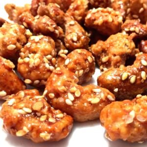 CASTANHA DE CAJU CARAMELIZADA COM GERGELIM KG